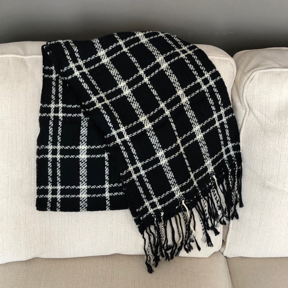 Black and white scarf with tassel fringe.